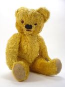 An early 20th century English blonde plush Teddy bear:,