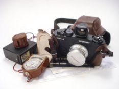 A Voitlander Bessa-L 35mm camera: with spare range finder, flash unit, light meter and film.