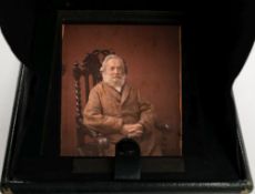 An early 20th century leather cased autochrome of a seated man by Heath, Plymouth:,