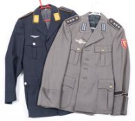 A West German paratrooper tunic together with a West German Luftwaffe tunic:,