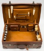 An Edwardian brown leather vanity case by ' The Alexander Clark Manufacturing Company', London:,