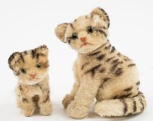A Steiff plush tabby cat and kitten:, both in a seated poise, with moveable heads, green glass eyes,