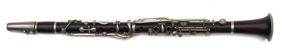 An early 20th century rosewood clarinet:, unsigned , with nickel plated keys,