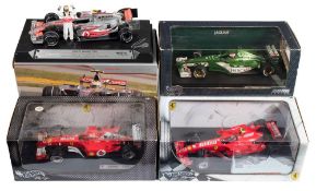 Hotwheels and others four 1/18th scale Formula 1 diecast racing cars: includes McLaren Mercedes,