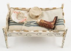 A 19th century scratch built prisoner of war style doll's bed:,
