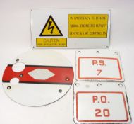 A BR circular enamel shunt signal:, together with three other BR enamel signs.