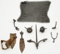 A section of heavy chain mail:, together with a part iron spur,