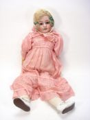 A Simon and Halbig bisque head doll:, applied blonde wig, brown glass sleeping eyes,