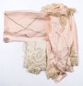 A late Victorian/early Edwardian lady's lace trimmed pink silk bedroom cape:,