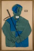 A framed set of blue and green jockey silks for E B Glenn:,
