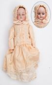 A German bisque shoulder headed doll by Cuno & Otto Dressel:,
