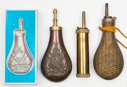 An Italian reproduction copper and brass powder flask and two other powder flasks:,