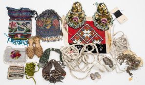 A collection of early 20th century beadwork evening bags and misers' purses:,etc.