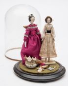 Two early 20th Century wooden dolls under a glass dome:, both with painted faces,