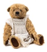 An M G Bears blonde plush 'Lucinda' Teddy Bear:, black glass eyes, stitched nose and mouth ,