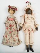 Two early 20th century large wooden Dutch type peg dolls:, both with applied wigs and painted faces,