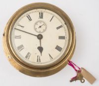An early 20th century circular brass ship's bulkhead clock:,