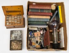 A collection of early 20th century dentistry equipment, books and false teeth:,
