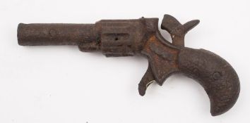 An early 20th century American cast iron 'Cadet' cap gun in the form of a revolver:, 10cm long.