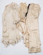 A late Victorian cream silk and lace trimmed bodice and skirt:,