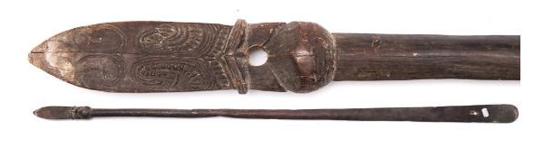 A Maori carved hardwood Taiaha: of traditional design with carved spear-shaped head and flattened