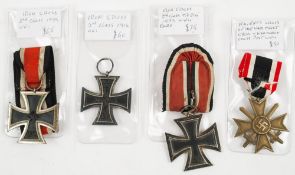 A WWI Iron Cross , 2nd Class:, together with two WWII Iron Crosses,