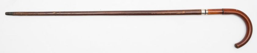 A 19th century swordstick:, the bamboo handle over silver ferrule and square sectioned blade,