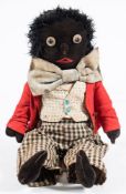 An early 20th Century cloth Golly doll:, with boot button eyes,