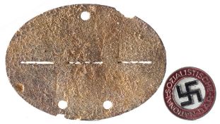 A German grey metal dog tag, stamped '4/ AEA SS-VT':,