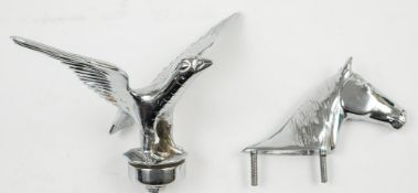A nickel plated horse head car mascot together with another of a bird with outstretched wings:,