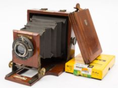 A late 19th century 'Le Mereveilleux' mahogany quarter plate camera by J Lancaster & Sons ,