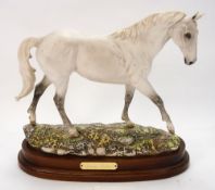 A Doulton Connoisseur model Dessert Orchid DA134:, limited edition number 820, on a wooden plinth,
