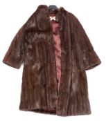 A full length mink fur coat by Maxwell Croft, London:.