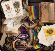 A collection of WWI & WWII medal ribbons, cap badges, buttons and related items:,