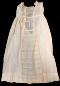 A Victorian white linen, lace-edged christening robe.