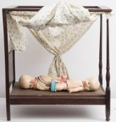 A miniature four poster doll's bed by Heal & Son, London:, 58 x 55 x 43cm,
