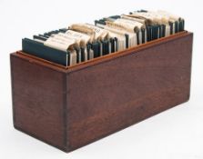 A personalised collection of 26 wallets containing monochrome photographs from the family of