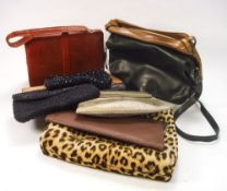 A Mappin and Webb lizard skin handbag:, a grey snakeskin bag, two leather clutch bags,