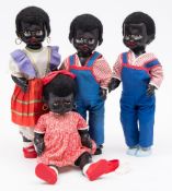 Four large plastic Negro boy and girl dolls: the boys with walking action and swinging head,