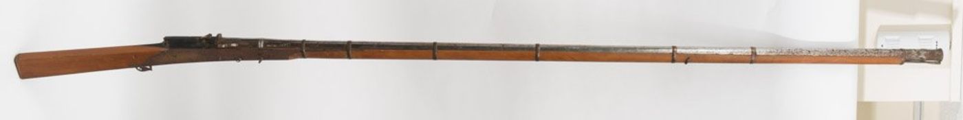 A large reproduction Indian matchlock, number 17743:, 232cm long.
