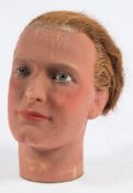 An early 20th century wax male mannequin head c1920s:, with applied red hair,