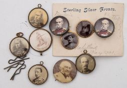 A collection of late 19th/ early 20th century silver and gold mounted souvenir buttons and badges