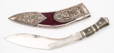 A kukri in a white metal mounted presentation scabbard:,