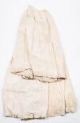 Three late Victorian/early Edwardian cream silk and lace trimmed skirts:, (stained and aged).