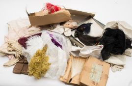 A collection of early 20th century lady's stockings and a group of various dressmakers/milliners
