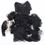 A group of seven late 19th/early 20th century black silk and lace bodices/jackets,