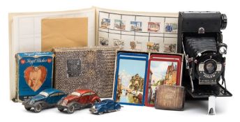 A Minic tinplate clockwork saloon:, together with two continental tinplate clockwork cars,