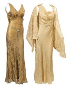 An early 20th century gold crepe silk evening dress with detachable cape:,