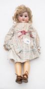 An Armand Marseille bisque head doll:, blonde wig, blue glass paperweight sleeping eyes,