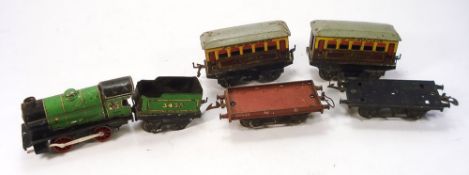 A collection of Hornby O gauge railway:, including a 0-4-0 BR green locomotive and tender,
